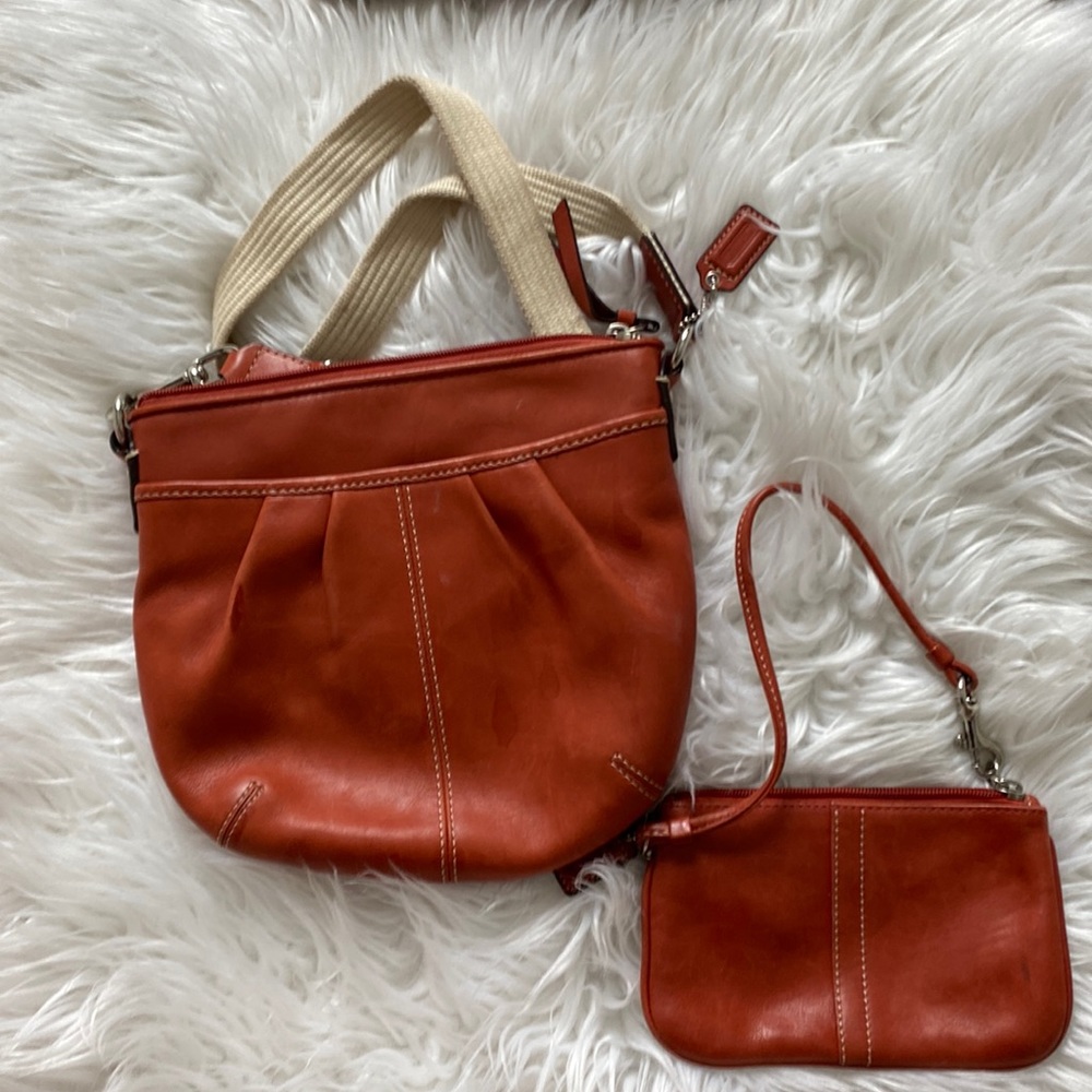 Coach crossbody bag and matching wristlet.